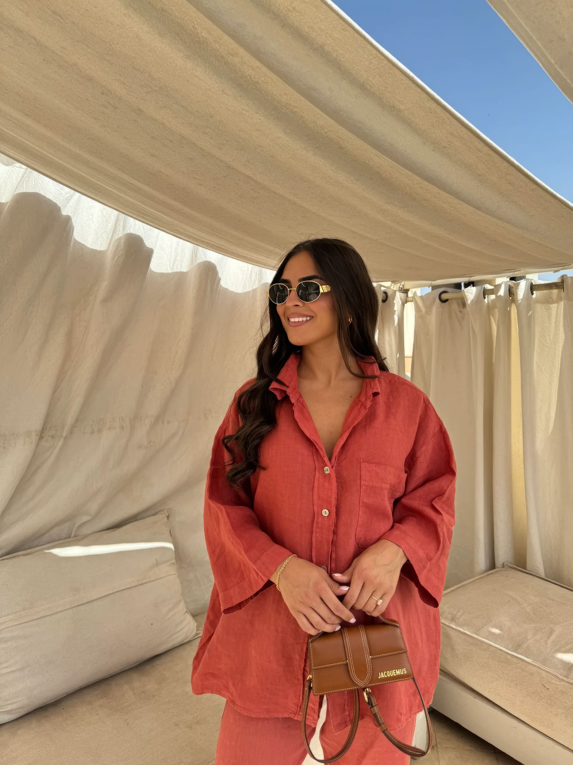 Coral red linen shirt and pants set with relaxed button-up silhouette