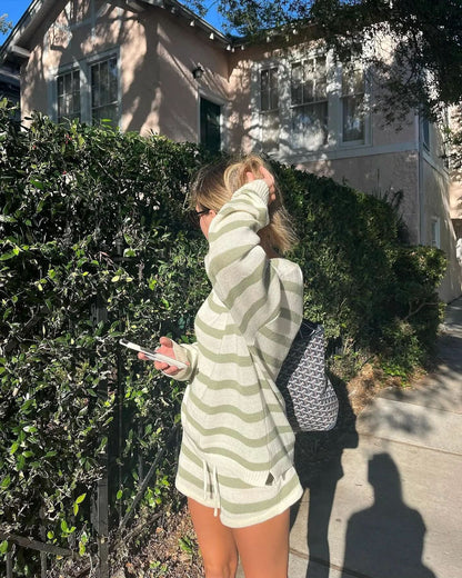 Back view of sage green and cream striped knit pullover