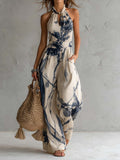 OXANA | HALTER NECK WIDE LEG JUMPSUIT - Ivory and Navy Print