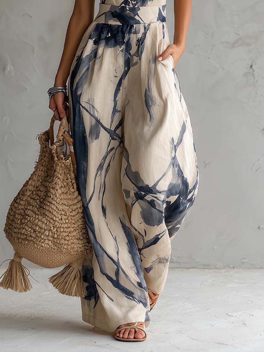 OXANA | HALTER NECK WIDE LEG JUMPSUIT - Ivory and Navy Print