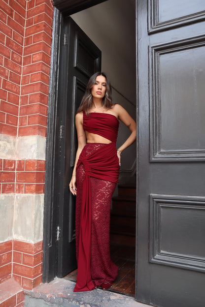 Burgundy lace maxi dress with strapless neckline and cutout waist detail