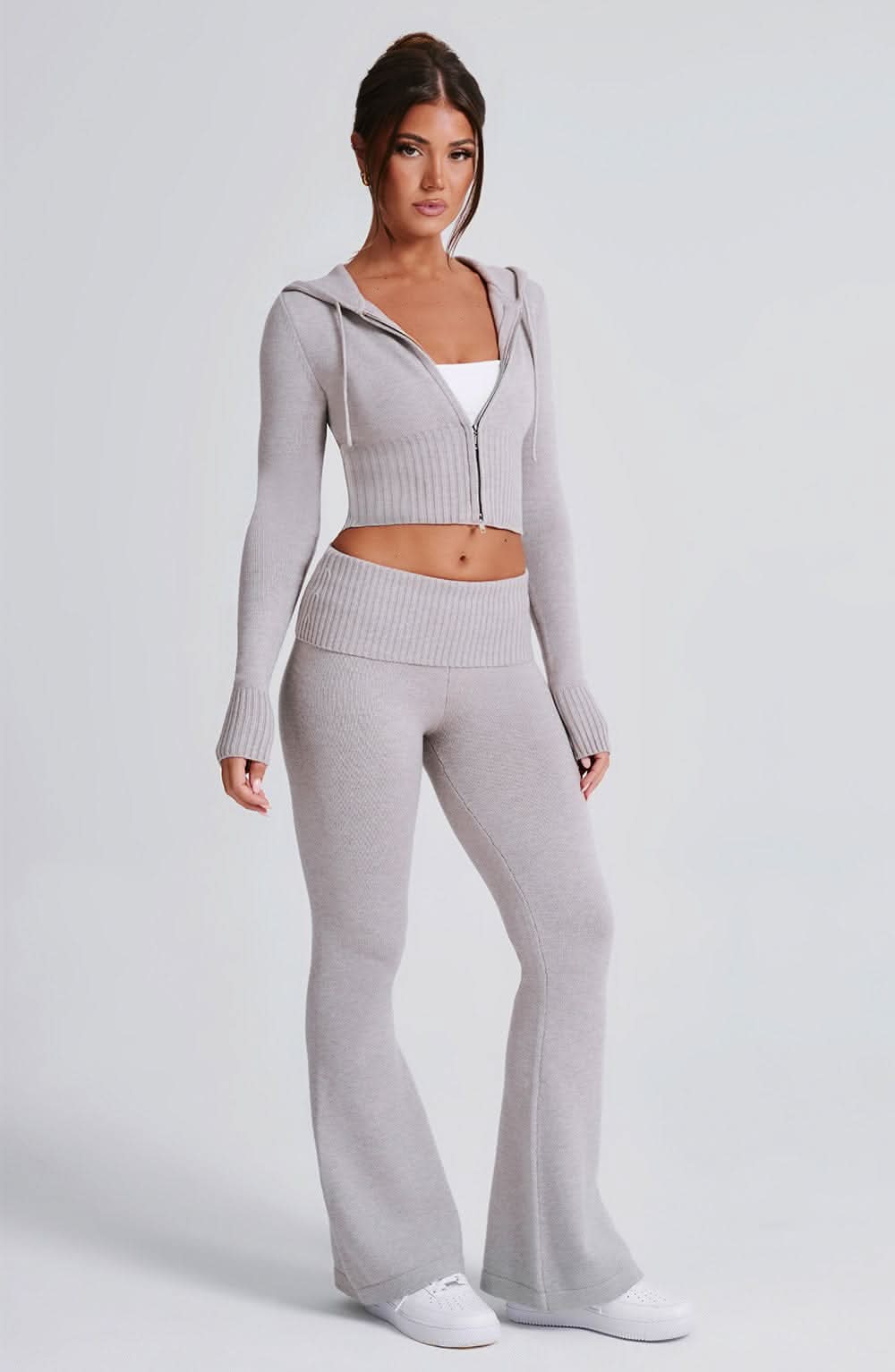 Beige hooded crop knit jacket with ribbed waistband and coordinating flare pants