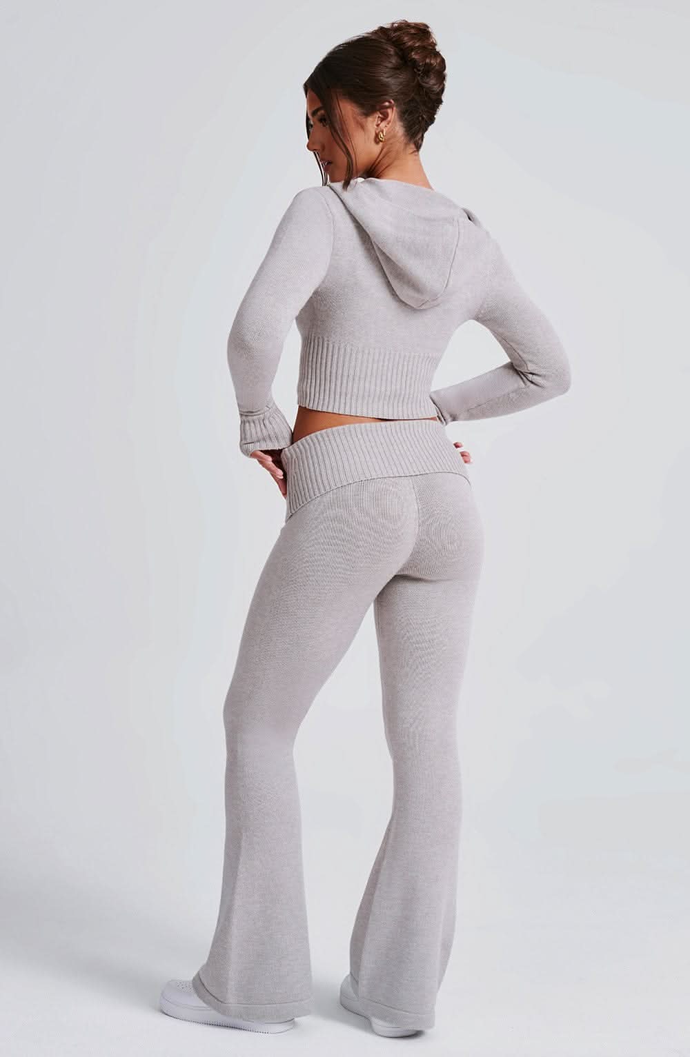 Rear angle of gray knit set with hooded crop top and high-waist leggings