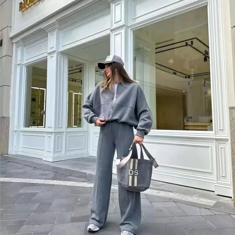 Gray two-piece tracksuit with cropped zip jacket and straight-leg pants