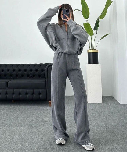 Gray tracksuit front view showing zip jacket with drawstring waist pants