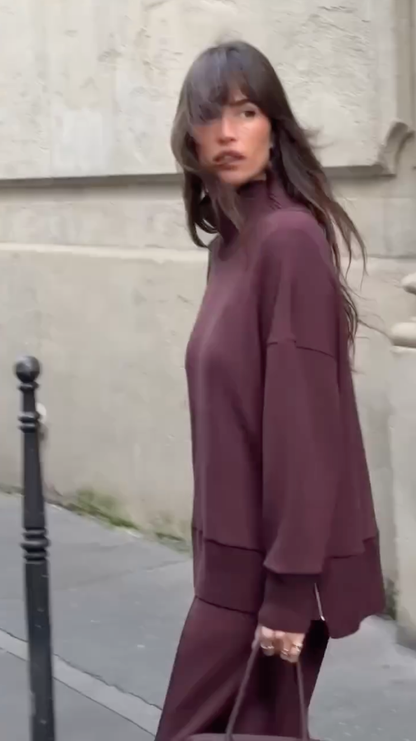 Back view of burgundy knit set showing relaxed fit sweater and straight-leg pants