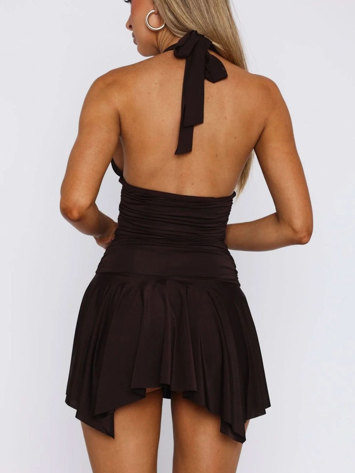 Black halter mini dress with ruched waist and tie-back detail rear view