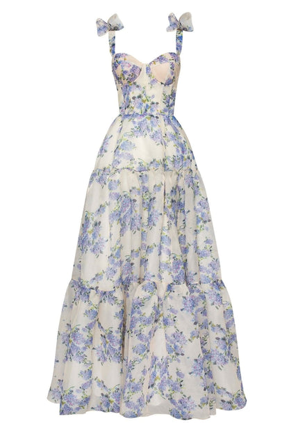 Full-length blue floral maxi dress with bow straps and tiered ruffle skirt
