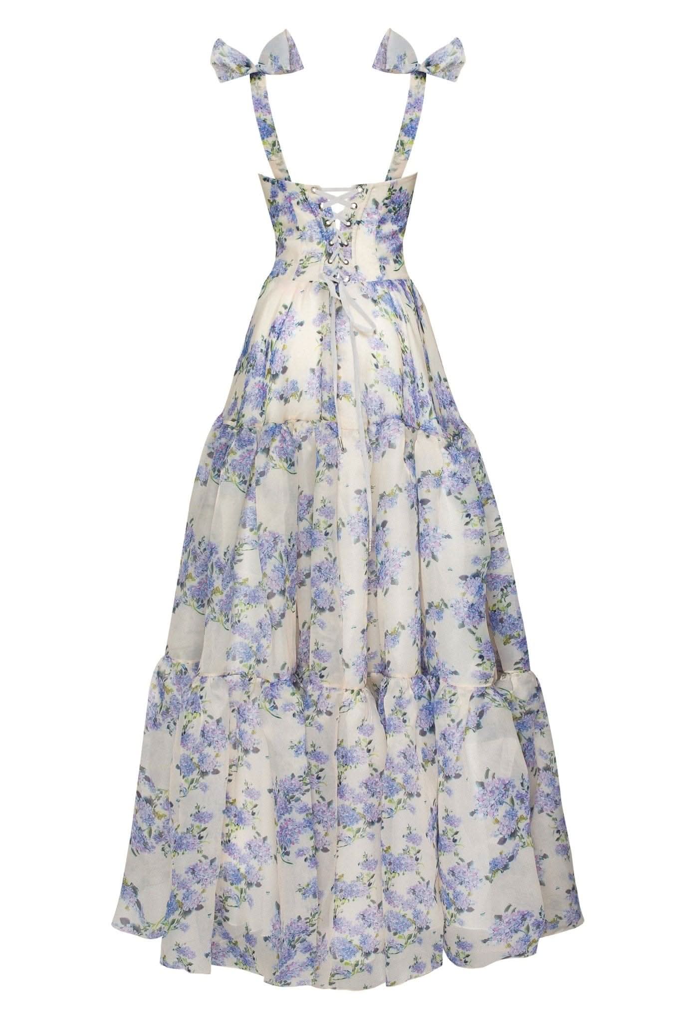 Back view of floral maxi dress with bow shoulder straps and layered skirt