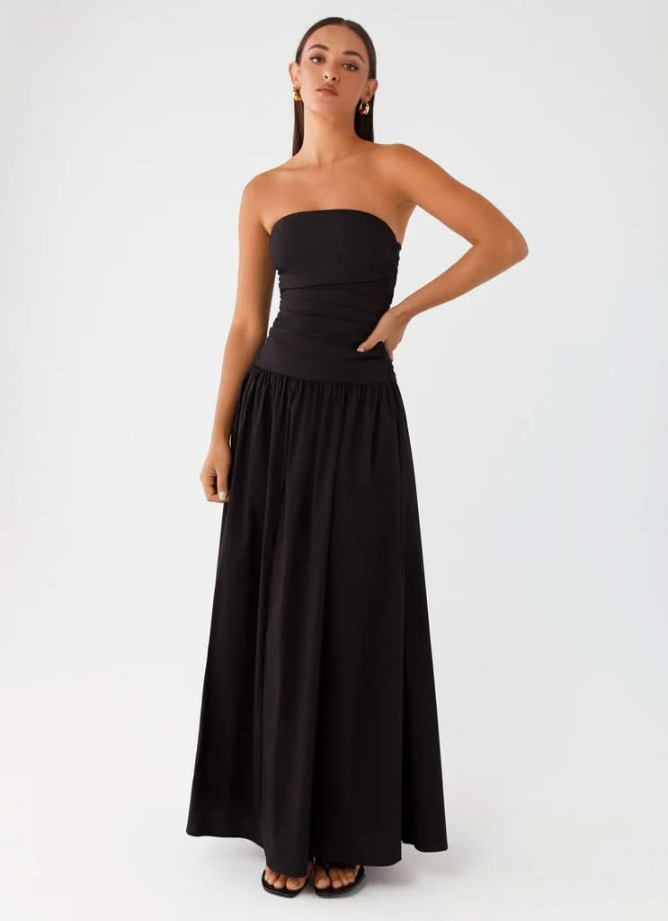 Black strapless maxi dress with gathered waist detail and voluminous skirt, front pose