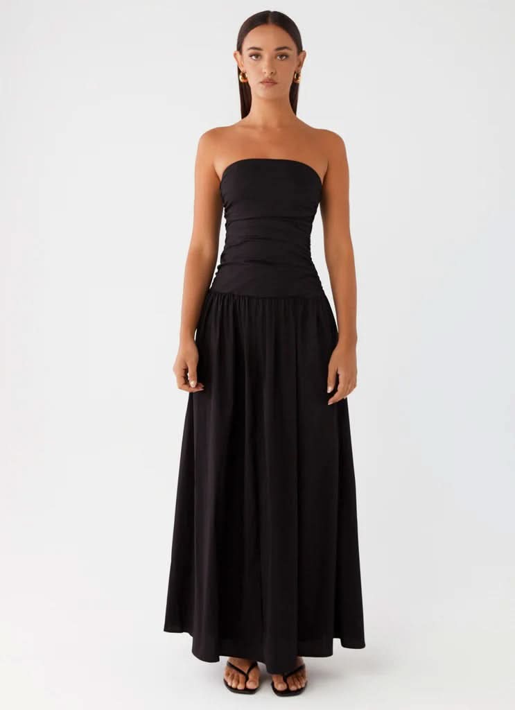 Black strapless maxi dress with ruched bodice and floor-length skirt, straight front