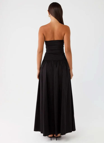 Black strapless maxi dress back view showing bare back and full gathered skirt
