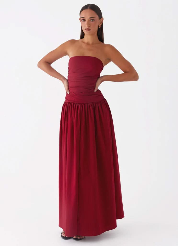Burgundy wine strapless maxi dress with ruched bodice and full skirt, front view