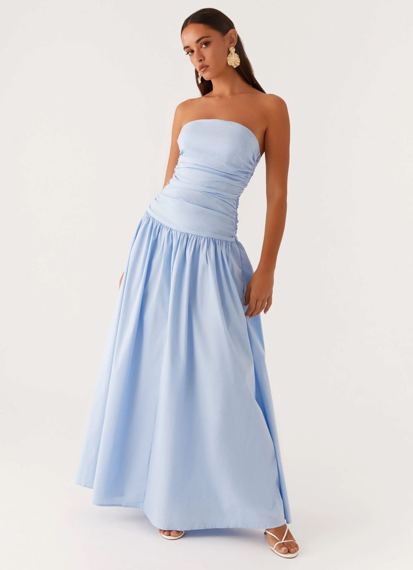 Light blue strapless maxi dress with ruched bodice and voluminous skirt, side view