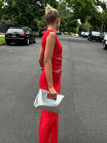 Red lace two-piece set side view showing fitted crop top and maxi skirt silhouette