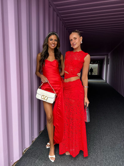 Red lace crop top and mini skirt set with sheer floral pattern and cutout details