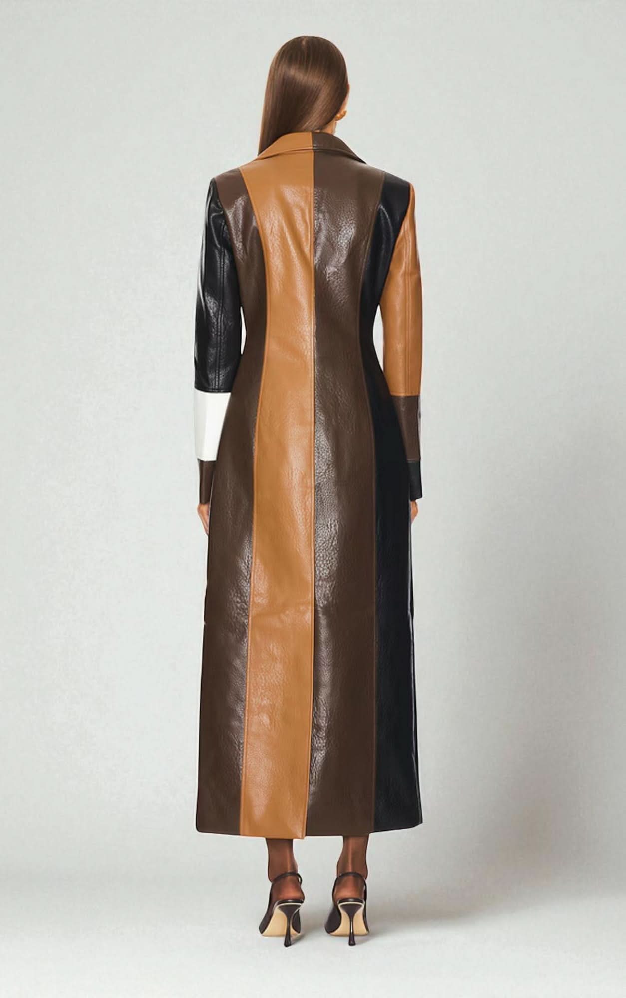 Back view of women's maxi leather coat with color-block panels in camel and black