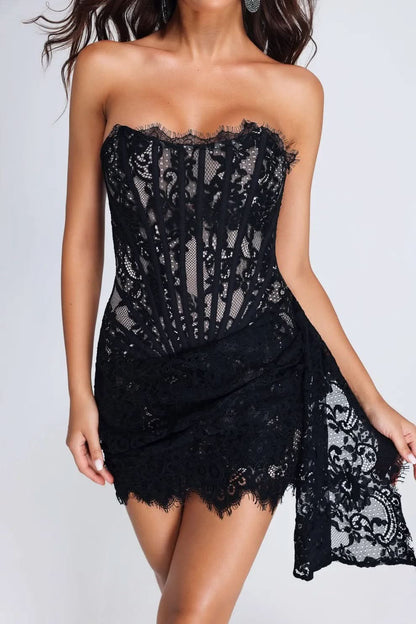 Back view of black lace strapless mini dress with corset lacing detail
