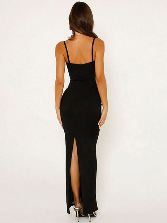 Back view of black maxi dress with open back and rear slit detail
