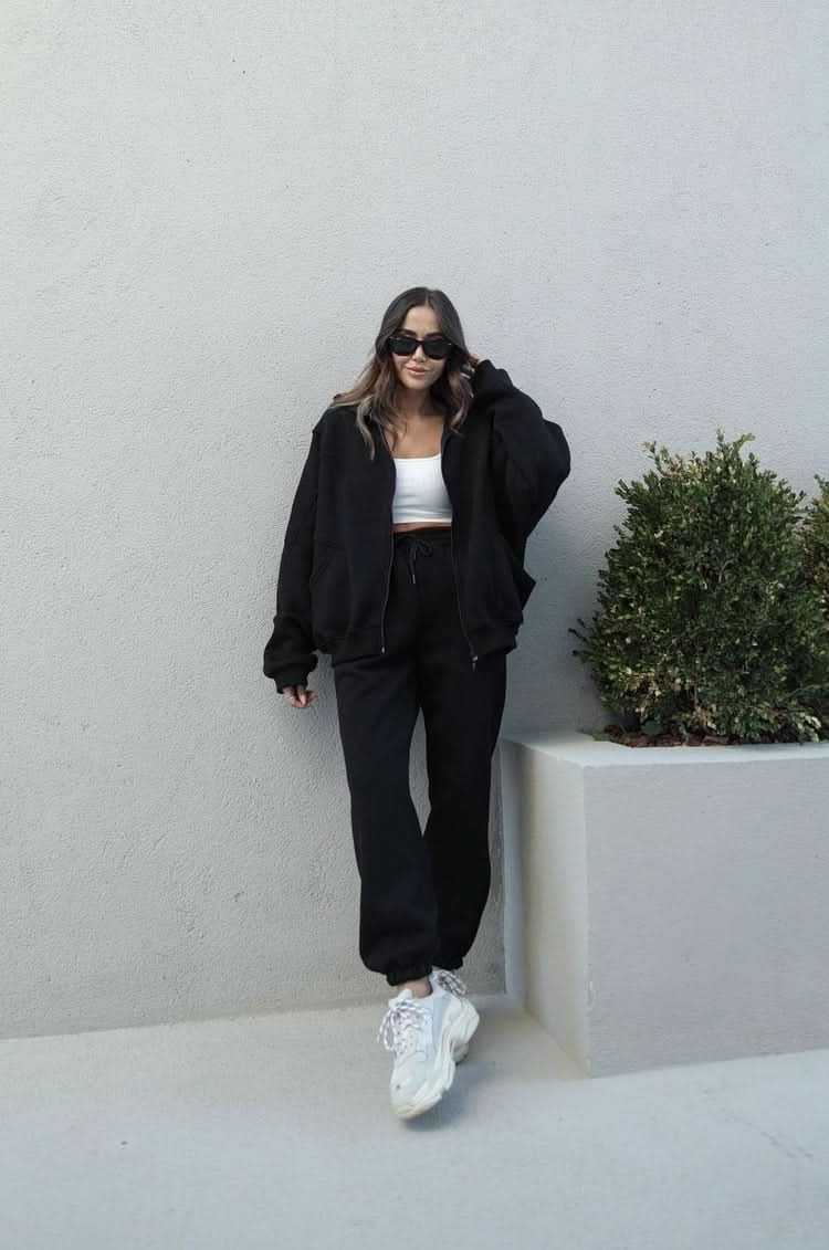 Black zip-up tracksuit with oversized hoodie and wide-leg pants