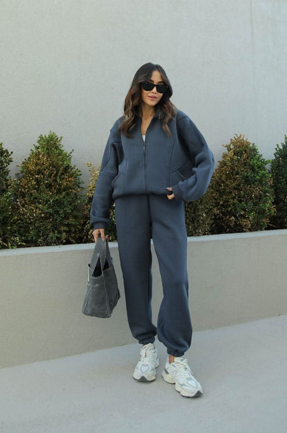 Slate blue zip-up tracksuit with relaxed fit and jogger pants