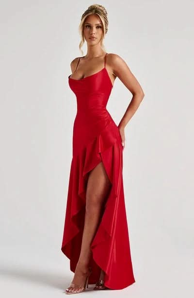 Red satin maxi dress side view showing draped asymmetrical skirt