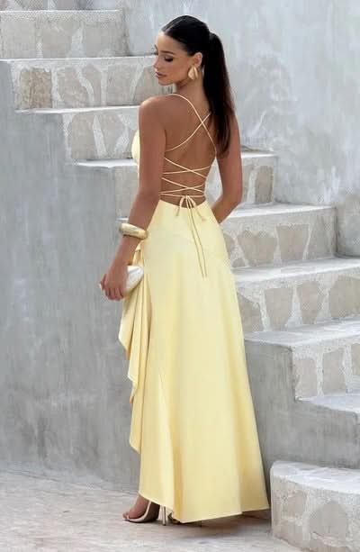 Back view of yellow maxi dress with crisscross lace-up back detail