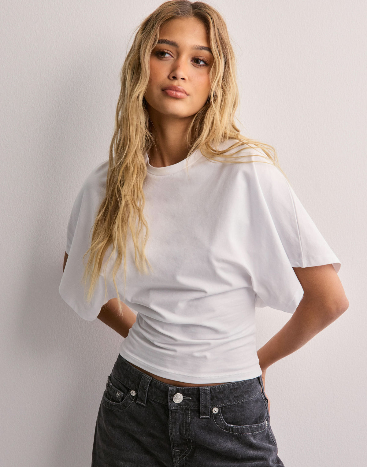 White wide sleeve tee front detail showing sleeve volume