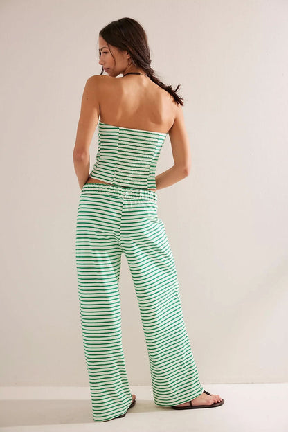 Back view of green and white striped strapless crop top and pants