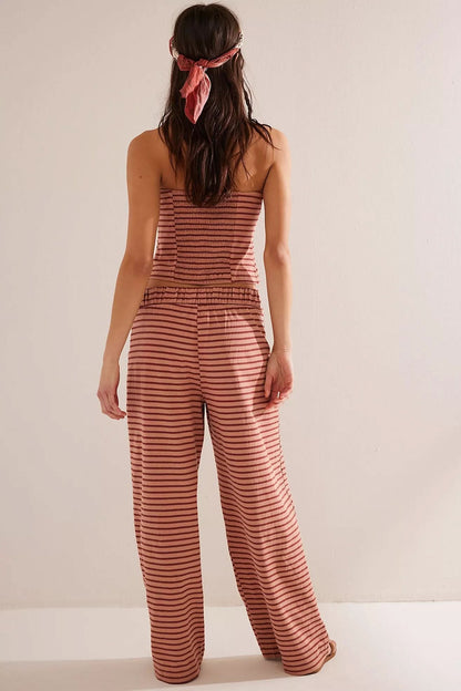 Back view of coral and white striped halter crop top and pants set
