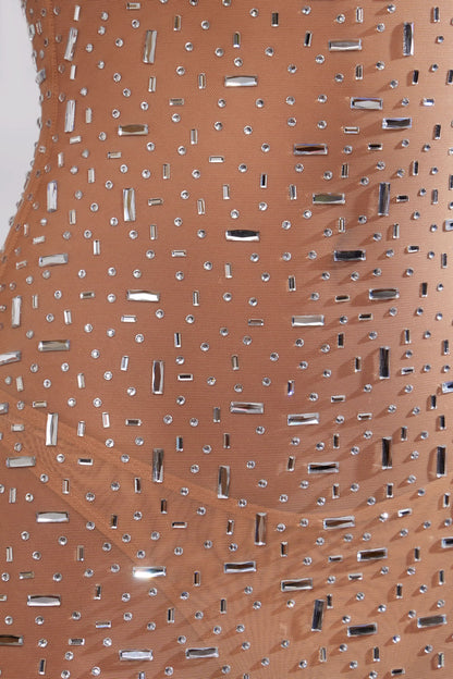 Close-up of champagne sequin fabric with rectangular and round sequins