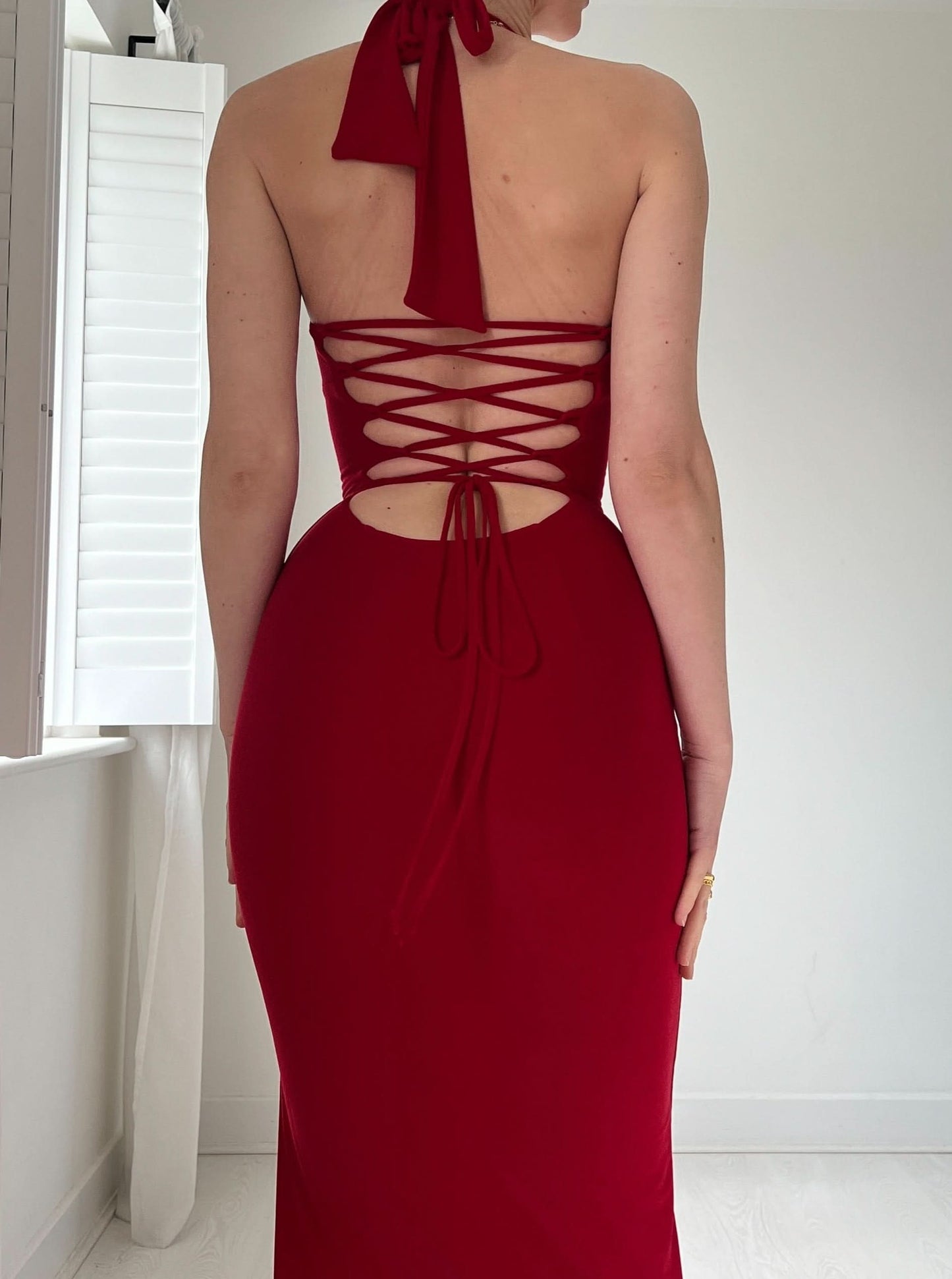 Red halter dress back with crossover lace-up design
