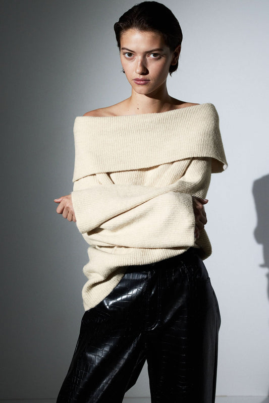 Cream ribbed knit off-shoulder sweater with draped neckline