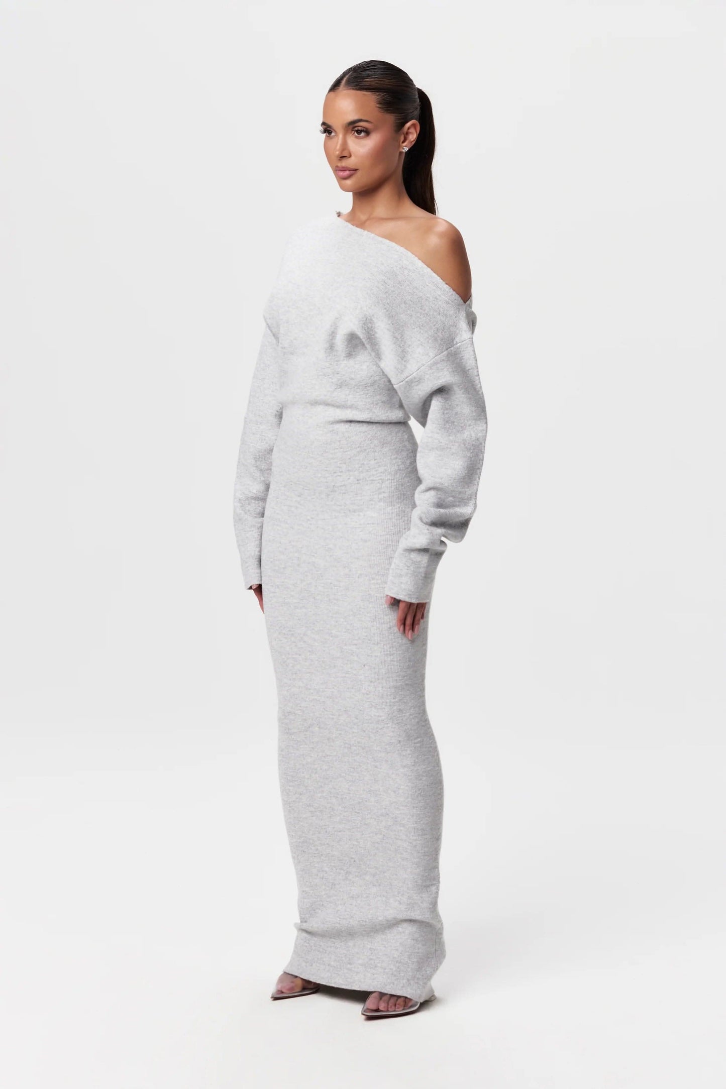Light gray off-shoulder knit maxi dress with long sleeves and fitted waist detail