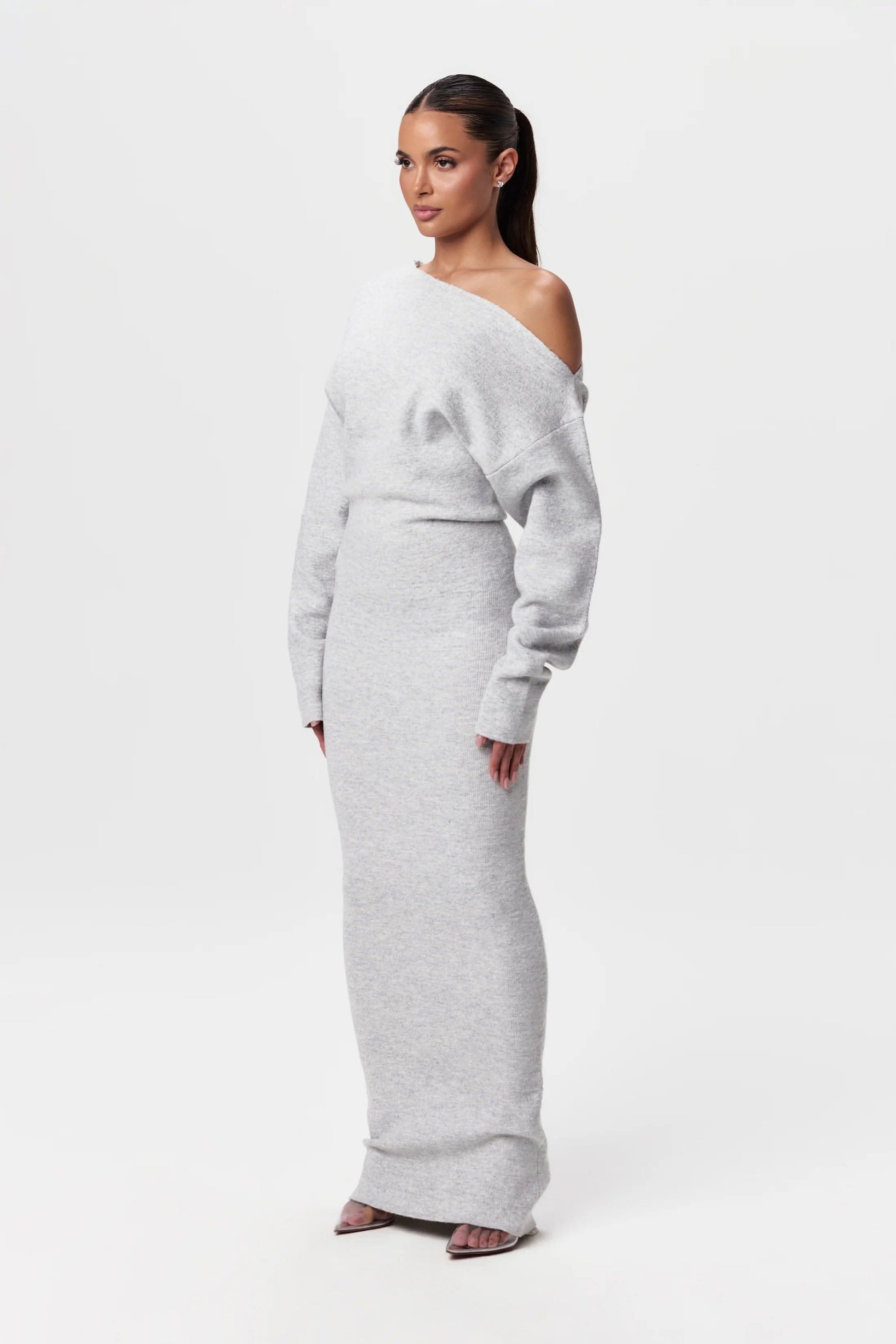 Light gray off-shoulder knit maxi dress with long sleeves and fitted waist detail