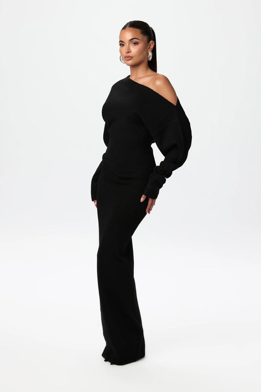 Black off-shoulder knit maxi dress with long sleeves and fitted silhouette