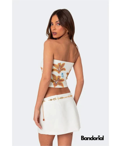 Strapless tube top back view showing orange lily print on white fabric