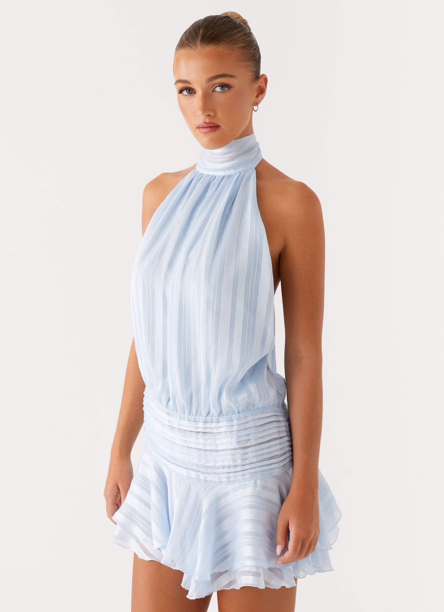 Light blue pleated halter chiffon mini dress with high neckline and ruched waist