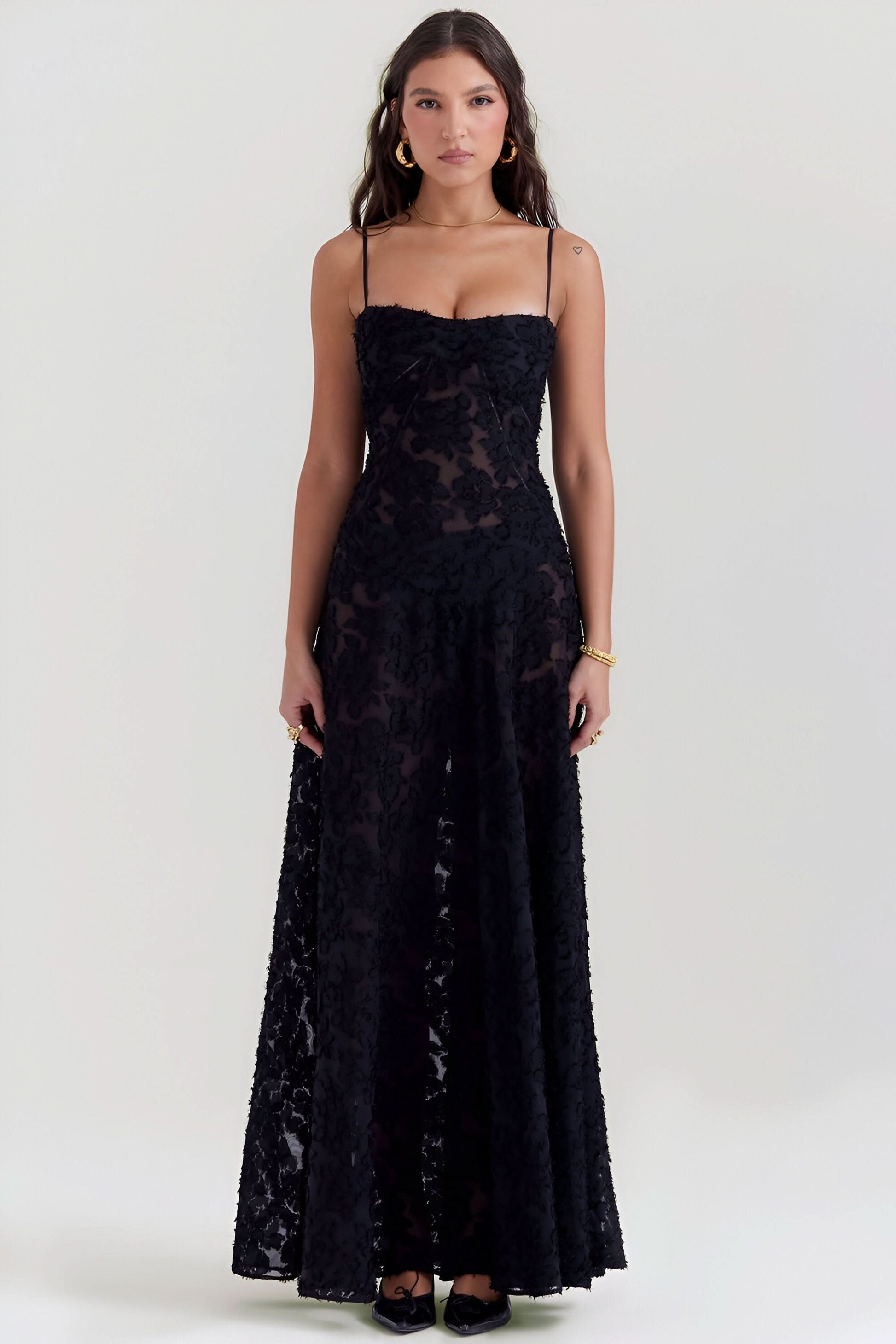 Black textured lace maxi dress with sweetheart neckline and flowing skirt