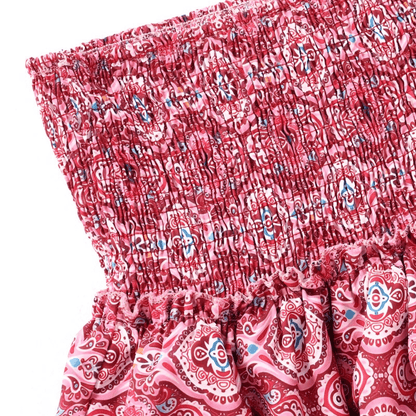 Close-up of pink ornamental patterned mini skirt with decorative ruffle details