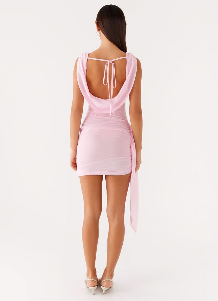 Pink ruched mini dress with cowl neckline and side tie detail back view