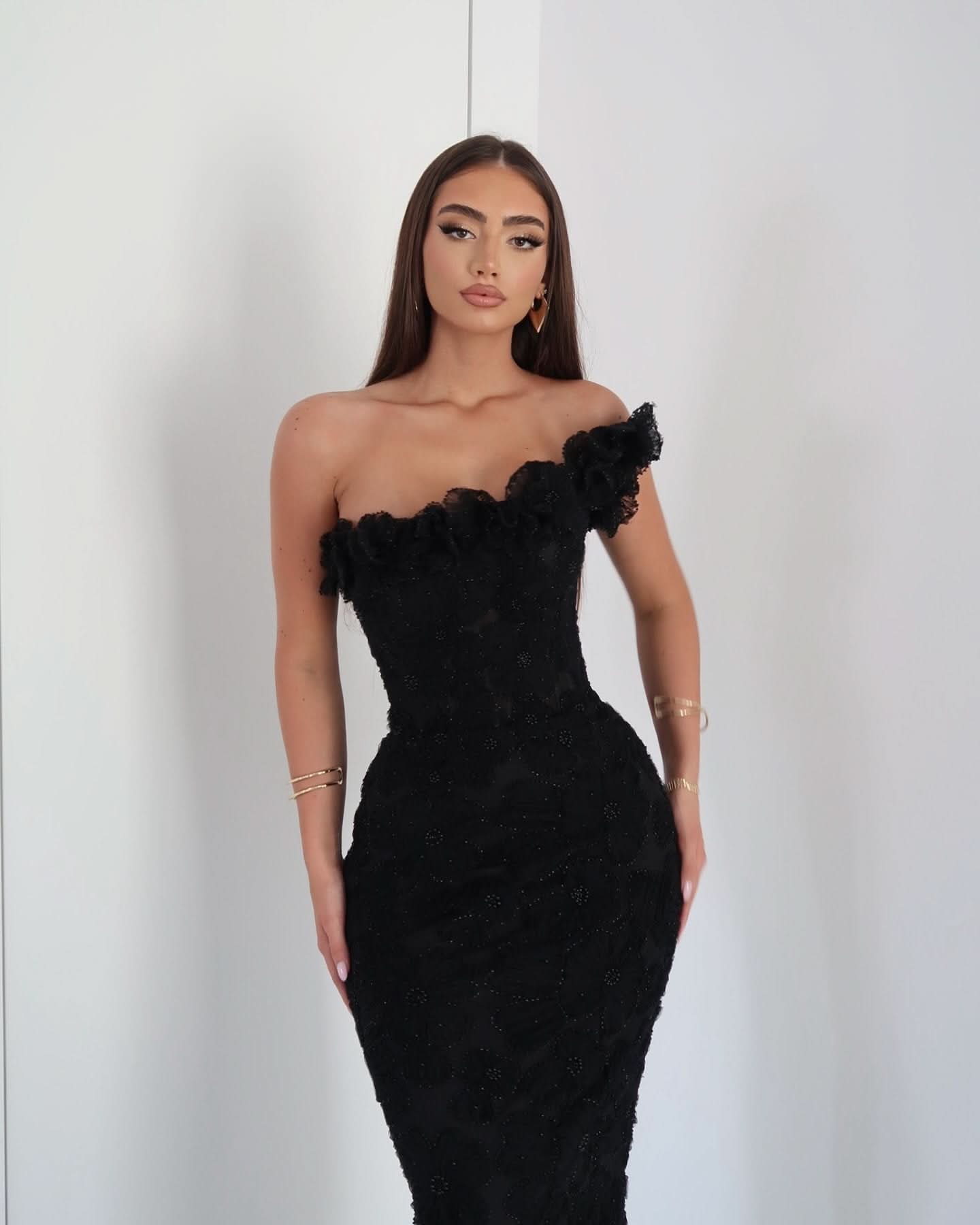 Black beaded off-shoulder maxi dress with ruffled neckline and beadwork detail