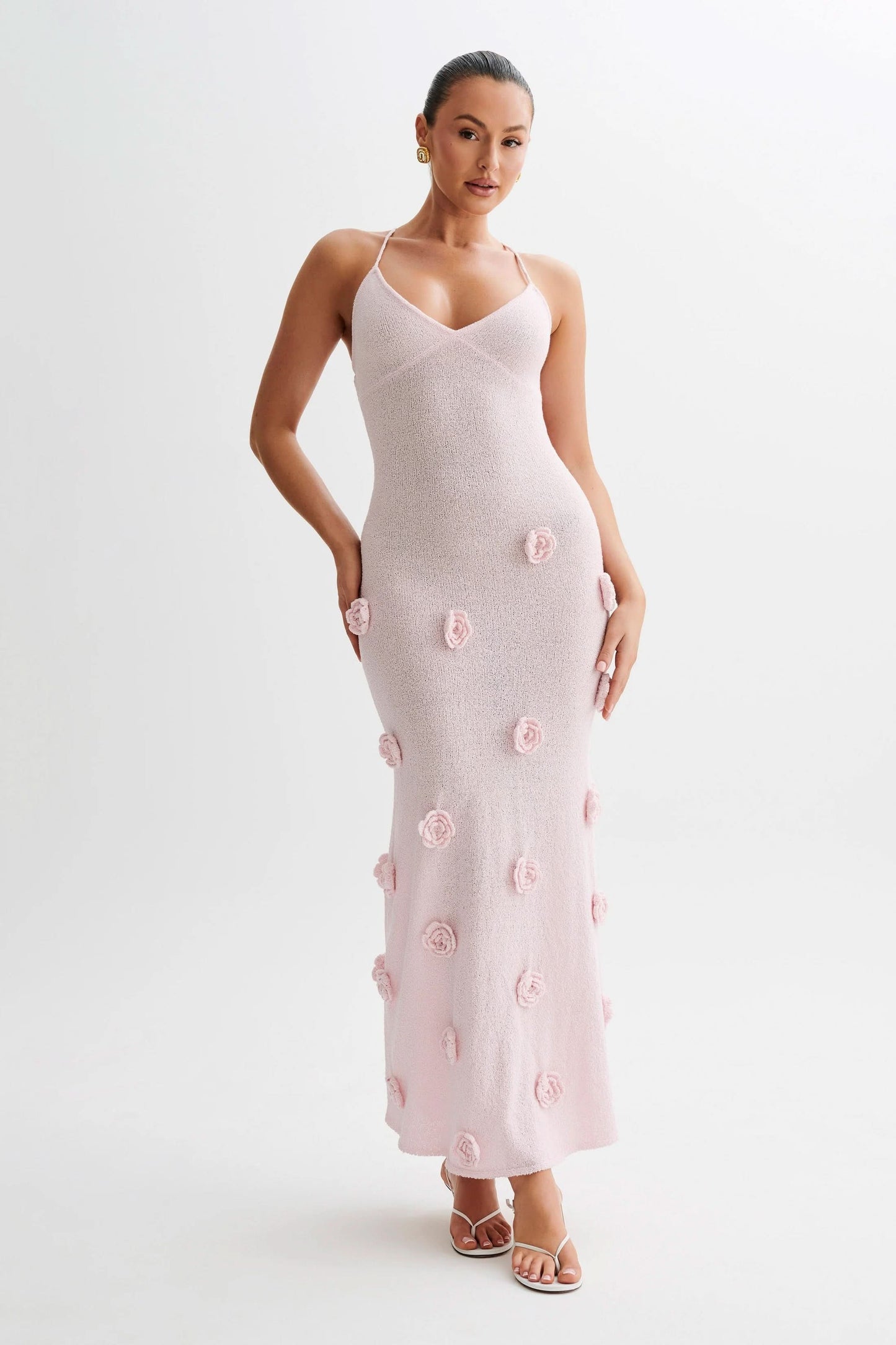 Pink maxi dress with 3D floral appliqués and V-neckline
