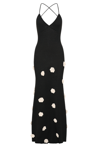 Black maxi dress with crossback straps and cream flower details