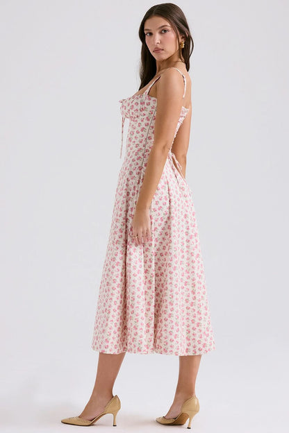 Back view of pink floral midi dress with open back detail