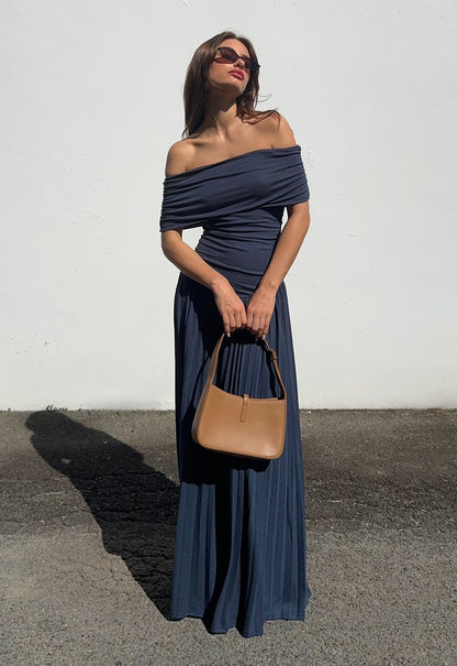 Navy off-shoulder maxi dress with gathered neckline and pleated skirt detail