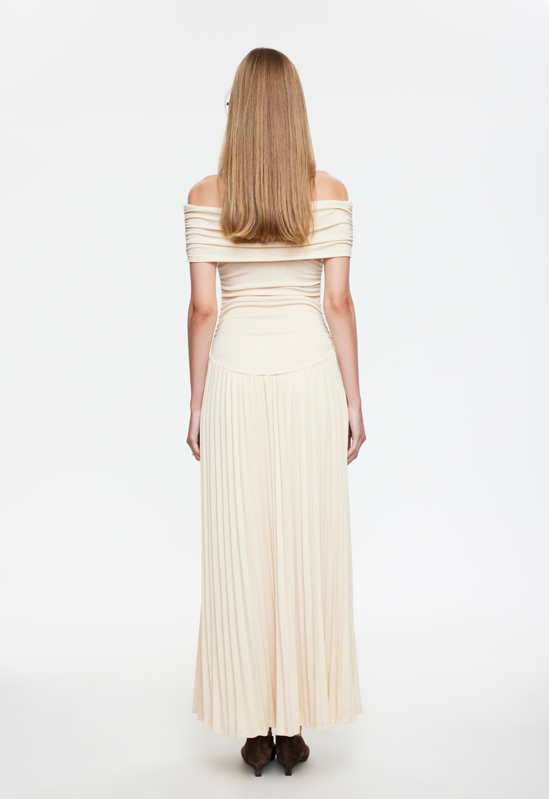 Cream shoulder maxi dress back view with off-shoulder sleeves and pleated hem