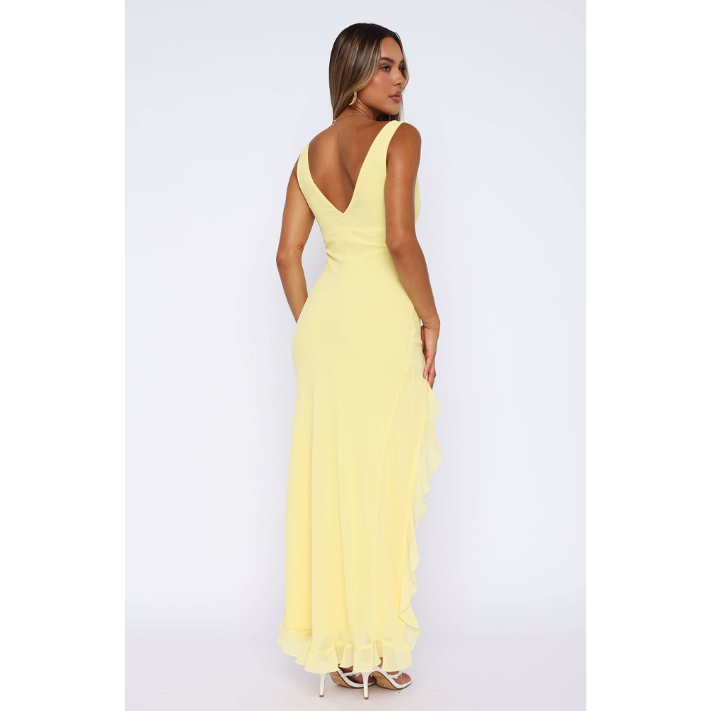 Back view of yellow sleeveless maxi dress with deep v-neckline
