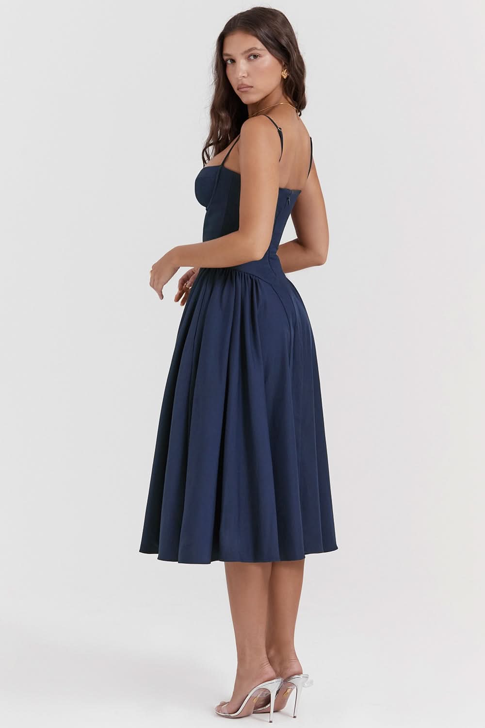 Navy blue strapless midi dress with full pleated skirt, side view