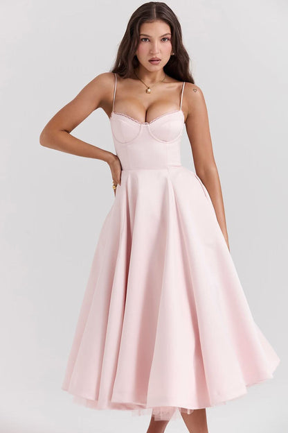 Pink midi dress with structured bodice and full A-line skirt silhouette